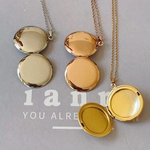Polished stainless steel round locket necklaces in gold, rose gold and silver finishes