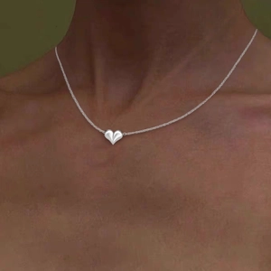 Elegant silver heart pendant necklace with a minimalist 3D design for women