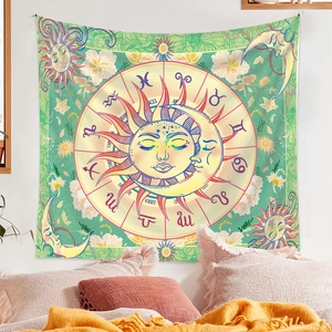 Detail of bohemian green tapestry featuring sun, moon, and twelve zodiac signs pattern