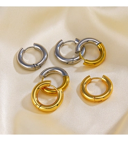 Detail of 4mm 18k gold and silver stainless steel chunky hoop earrings on silk fabric