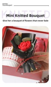 Detail of a handmade red knitted rose bouquet in elegant black packaging with a red ribbon