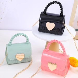 Mini heart jelly handbags in black, pink, and green with elegant gold chain straps