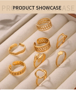 Detailed view of 8-piece gold-plated titanium steel rings in a velvet jewelry box