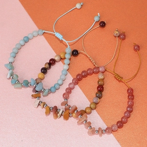 Detail of four-piece handmade bohemian bracelets with natural stones and adjustable ropes