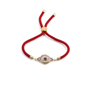 Bracelet tressé rouge rétro avec breloque œil porte-bonheur dorée et zircons colorés