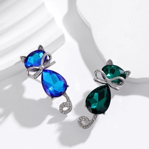 Elegant cat brooches with blue and green gemstones and sparkling rhinestone accents