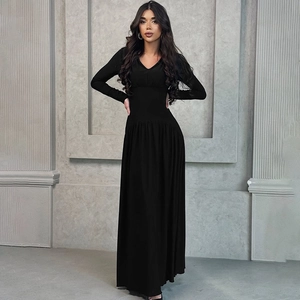 Detailed view of women's black long sleeve dress with slim fit waist and deep V-neckline