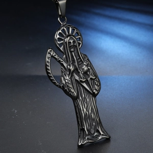 Macro shot of stainless steel Santa Muerte pendant with scythe and scales detail