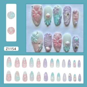 3D floral press-on nails with pearls and shell texture in pink and mint green