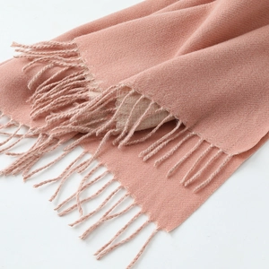 Pink cashmere winter scarf for men and women with fringed edges in diagonal shot