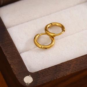 Pair of minimalist 18K gold plated stainless steel hoop earrings in a jewelry box