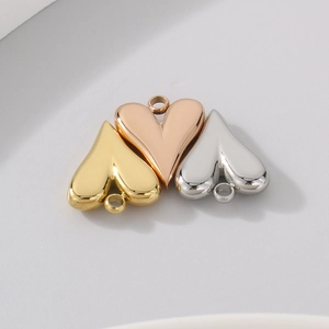Polished stainless steel heart-shaped pendants in gold, rose gold, and silver finishes