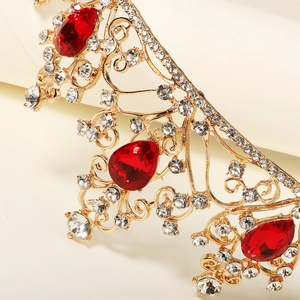 Luxurious gold crown for brides featuring red teardrop gemstones and white crystals