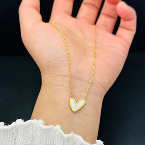 Titanium steel heart pendant necklace in gold finish with white inlay on palm
