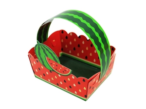 Close-up of watermelon themed party favor box with green handle and red seeded pattern