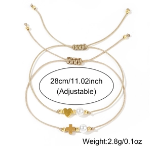 Adjustable woven bracelet set with faux pearls and gold heart and cross pendants