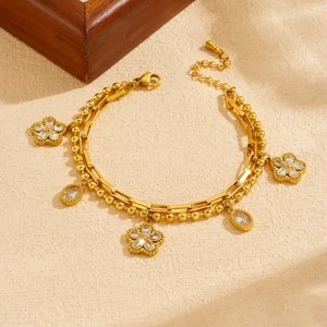 Elegant gold-plated double-layer bracelet with crystal flowers and teardrop charms