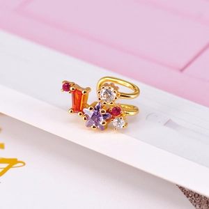 Macro shot of 18K gold plated ear cuff with colorful star and rectangular zircon stones