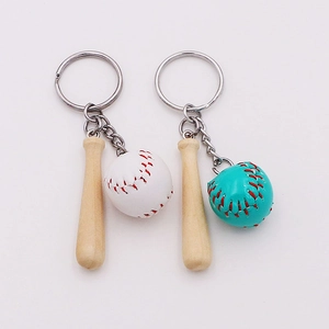 Detailed view of mini wooden baseball bat keychain with white and blue leather balls