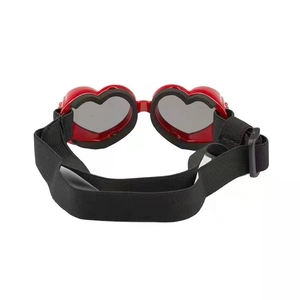 Foldable heart-shaped pet sunglasses with red frames and adjustable black elastic strap