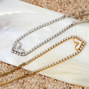 Adjustable heart bracelet in gold and silver with sparkling zircon pavé on a sea shell