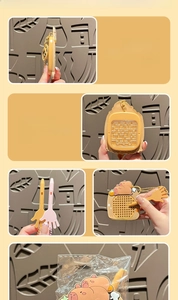 Detail of Capybara maze keychain showing the puzzle game with stylus and metal ball chain