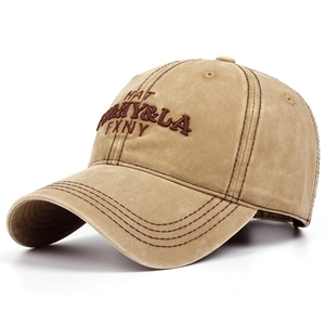 Close-up of vintage washed khaki baseball cap with 3D letter embroidery and stitched brim