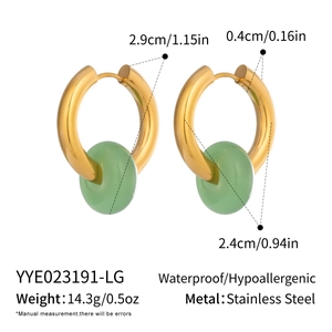 Macro view of gold stainless steel hoop earrings with green stone and size dimensions