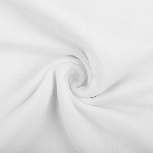 Detailed close-up of white mesh fabric texture with elegant spiral pleated draping