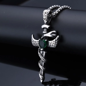 Gothic silver sword pendant with green heart gemstone and winged snake details