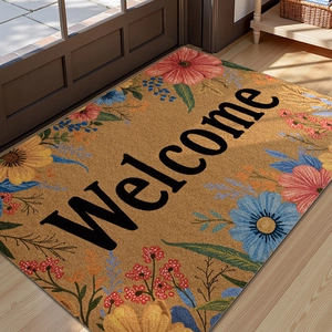 Floral welcome mat with PVC silk loop texture placed on a light wooden floor by a brown door