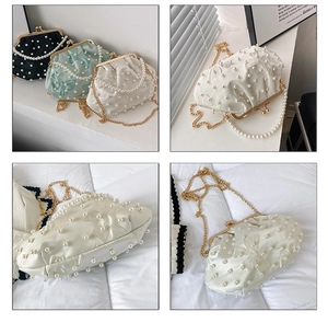 Detail of elegant shell bag with pearl handle and lace bow in multiple colors