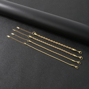 Detailed view of four golden stainless steel twist rope bracelets with adjustable lobster clasps