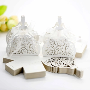 Detailed laser-cut pattern on pearlescent ivory candy box with white ribbon