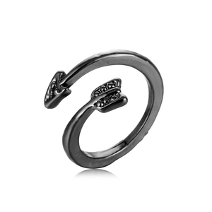 Detail of adjustable black arrow ring with metallic finish and unique punk aesthetic