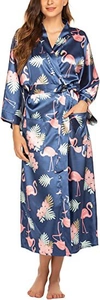 Detail of long satin robe featuring pink flamingo and tropical palm leaf patterns