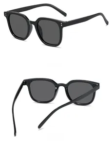 Detail view of stylish square sunglasses featuring black frames and silver metal accents
