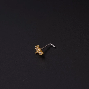 Macro shot of gold floral nose stud with clear zircons and silver L-shaped steel post