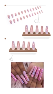 Macro detail of coffin shaped press-on nails with pink purple gradient and pearl floral art