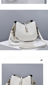 Detail view of white shell bag featuring gold hardware and leather chain strap