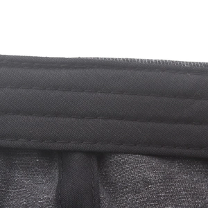 Detailed macro view of reinforced stitching on washed cotton baker boy cap headband