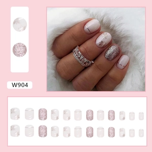 Short square pink press-on nails set with glitter snowflakes and metallic lines