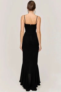 Detail of the back zipper and pleated waist on a black bodycon mermaid maxi dress