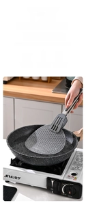 Detail of grey silicone mat showing fish scale texture and -40 to 230 degrees resistance