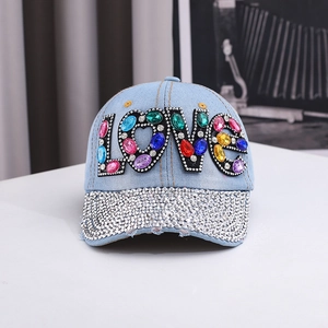 Detailed macro shot of the colorful rhinestone LOVE lettering on this denim baseball cap