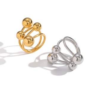 Minimalistischer geometrischer Edelstahlring mit polierten Gold- und Silberkugeln