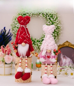 Close-up of Valentine Gnomes with sequined hats and pearl-beaded hanging legs
