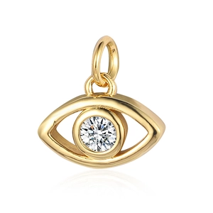 Macro shot of gold eye-shaped pendant with sparkling clear zircon stone and jump ring