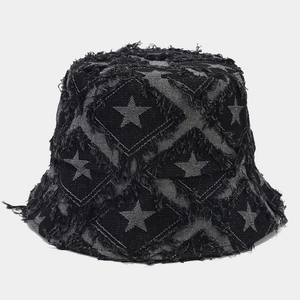 Macro shot of black washed denim bucket hat featuring star quilt and frayed raw edges