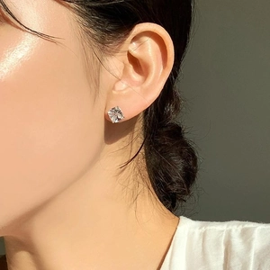 Classic princess cut cubic zirconia stud earrings in sterling silver on model